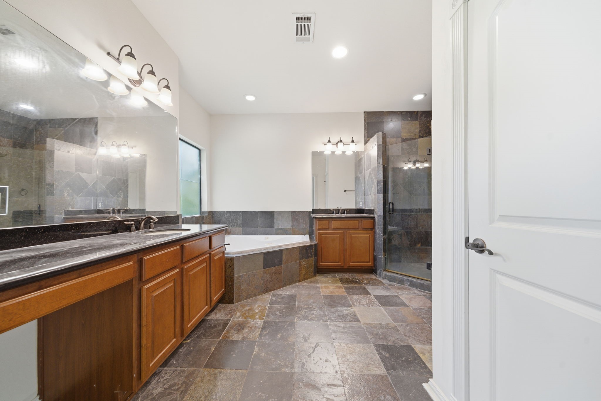 5310 Larkin Street, Unit B Houston, TX 77007 - Photo 27 of 36 a large kitchen with a large counter top cabinets and stainless steel appliances