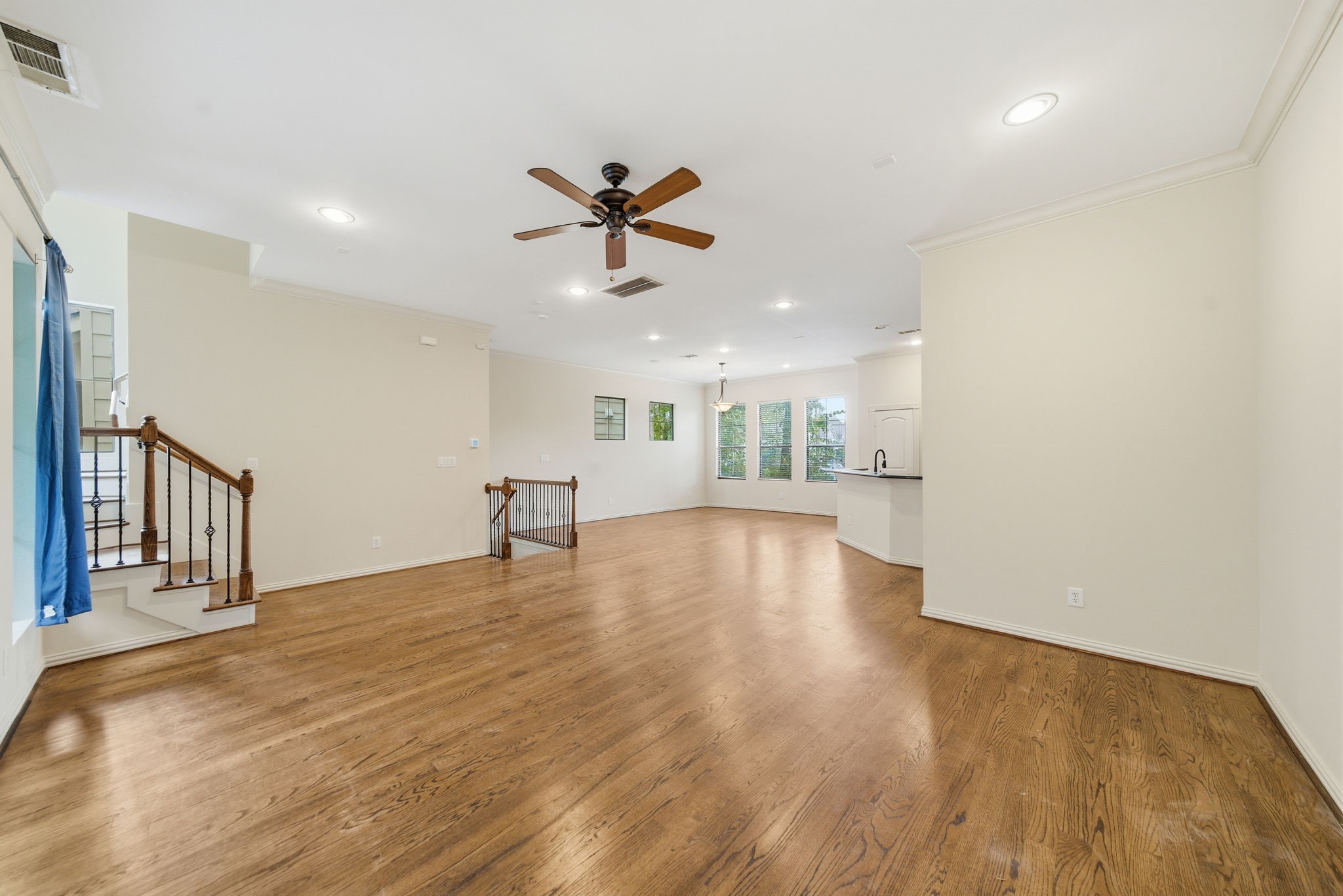 5310 Larkin Street, Unit B Houston, TX 77007 - Photo 7 of 36 a view of an empty room with a window and wooden floor