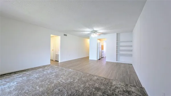 a view of an empty room with a window