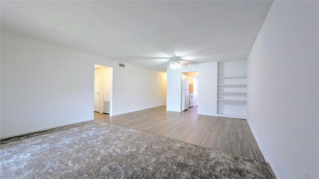 5957 Casa Del Rey Circle, Unit A Orlando, FL 32809 - Photo 4 of 6 a view of an empty room with a window