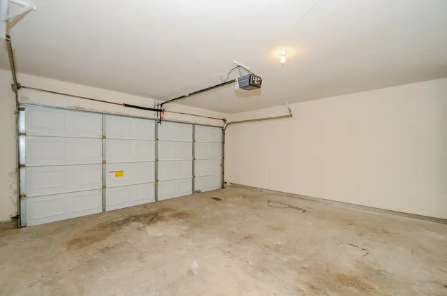 a view of a house with backyard and garden