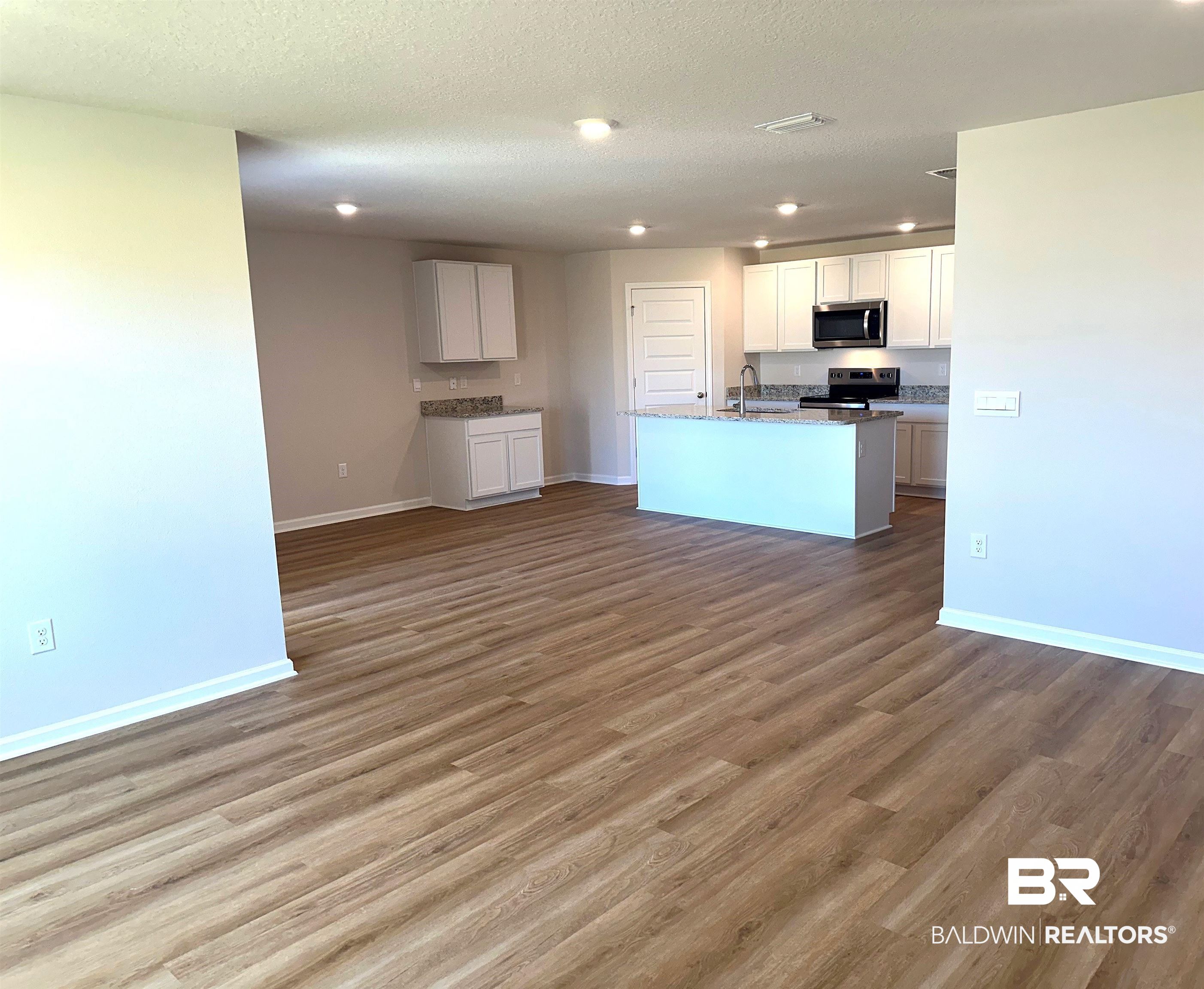 1234 Hayward Loop Foley, AL 36535 - Photo 9 of 31 Living room to kitchen