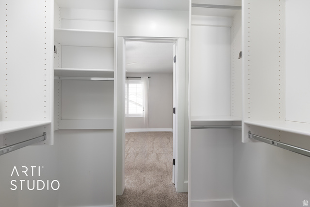 704 West Vahe Street Draper, UT 84020 - Photo 17 of 35 Master bedroom white custom closet organization system featuring adjustable shelving and chrome hanging rods