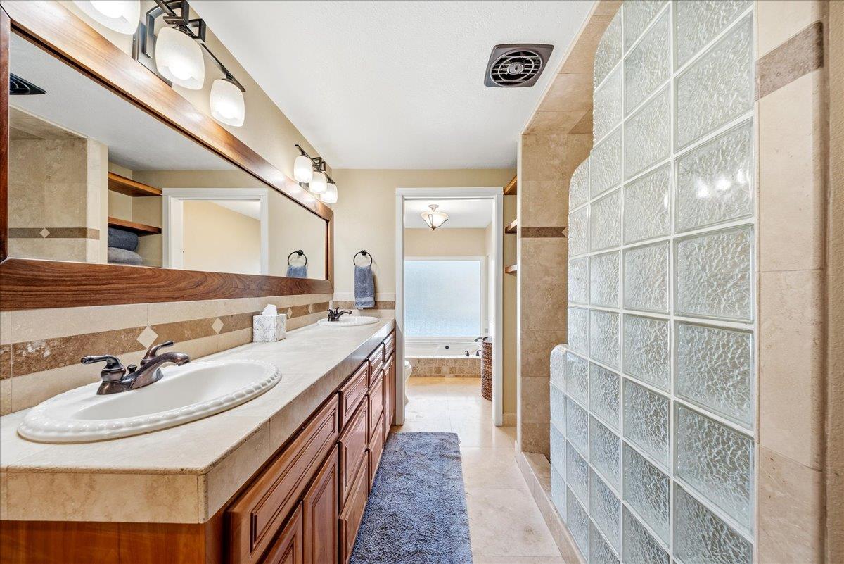 16035 Running Springs Road Grass Valley, CA 95949 - Photo 21 of 94 a bathroom with a double vanity sink and a mirror