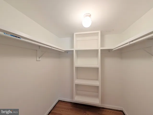 a view of an empty walk in closet