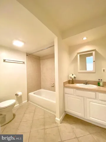 a bathroom with a sink a toilet and a bathtub