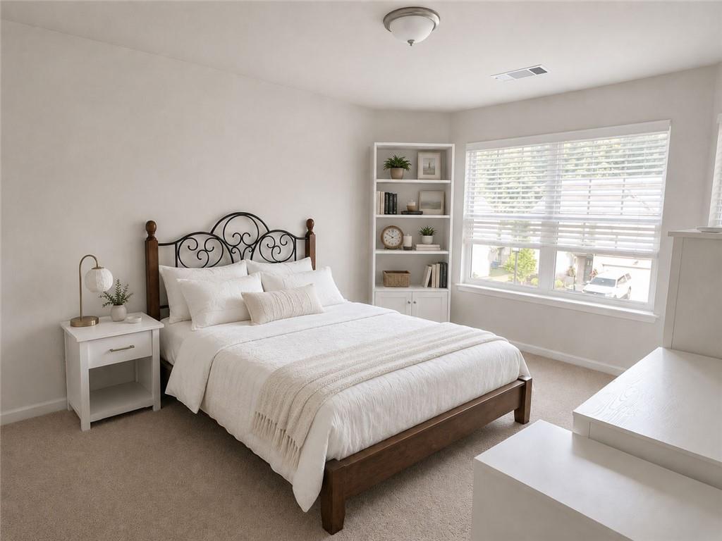 3359 Elkhorn Ridge Run Dacula, GA 30019 - Photo 23 of 35 a bedroom with a bed and a window