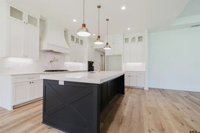 a large kitchen with a large island in it