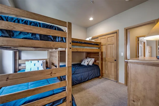a bedroom with bed and a large closet