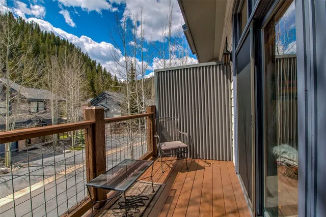 a view of balcony with wooden floor