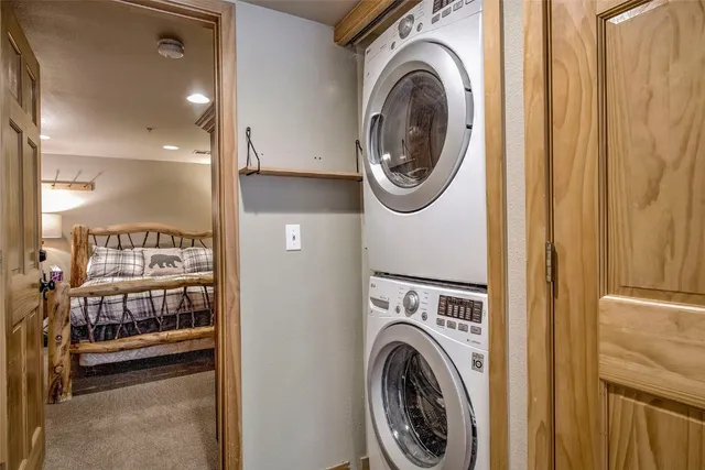 a view of a hallway with washer and dryer