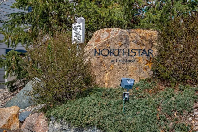 a sign that is on a brick wall