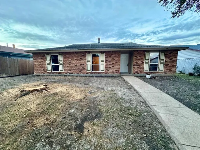 a front view of a house with yard