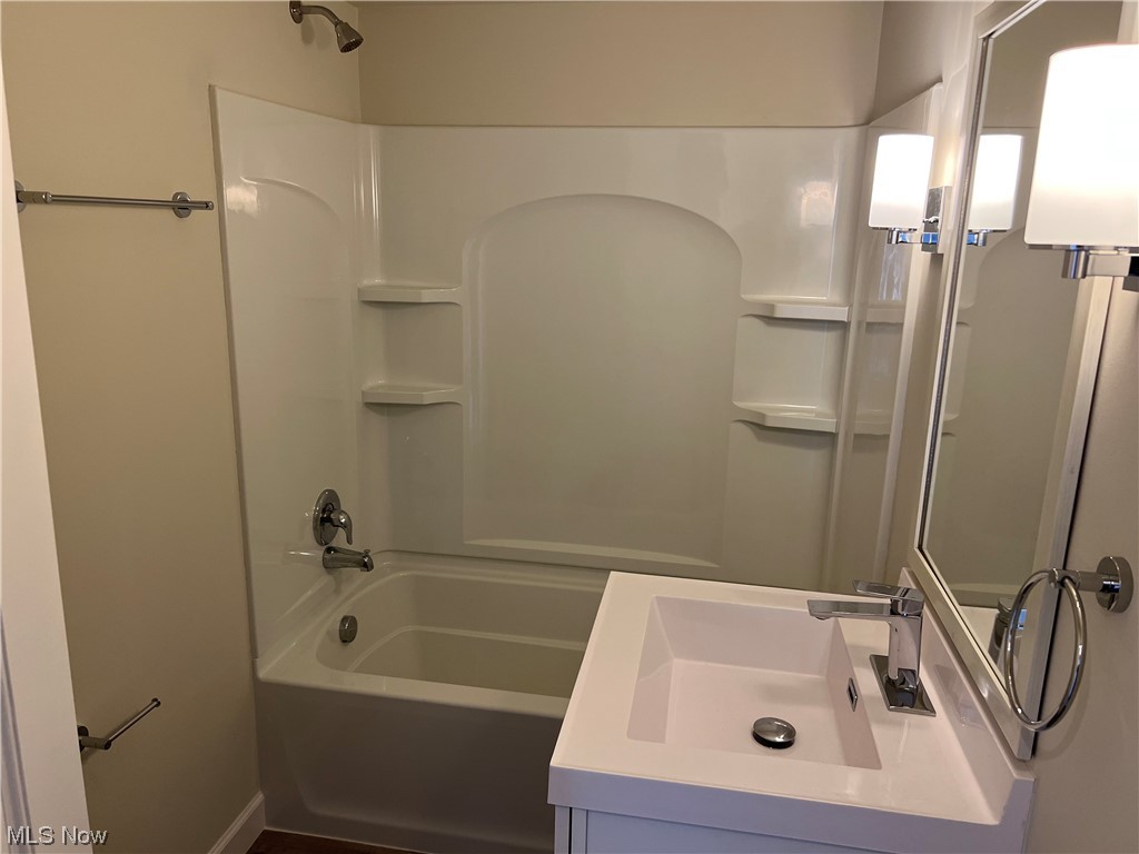 1609 Lyndhurst Road Lyndhurst, OH 44124 - Photo 19 of 34 Bathroom with bathtub / shower combination, vanity, and mirror