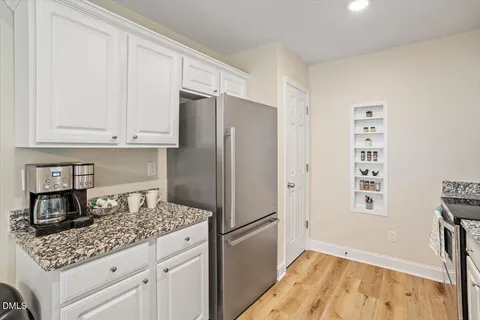 a kitchen with appliances cabinets and a counter top space