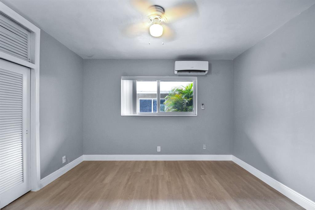 4751 Northeast 21st Terrace, Unit 4 Lighthouse Point, FL 33064 - Photo 16 of 22 an empty room with a window