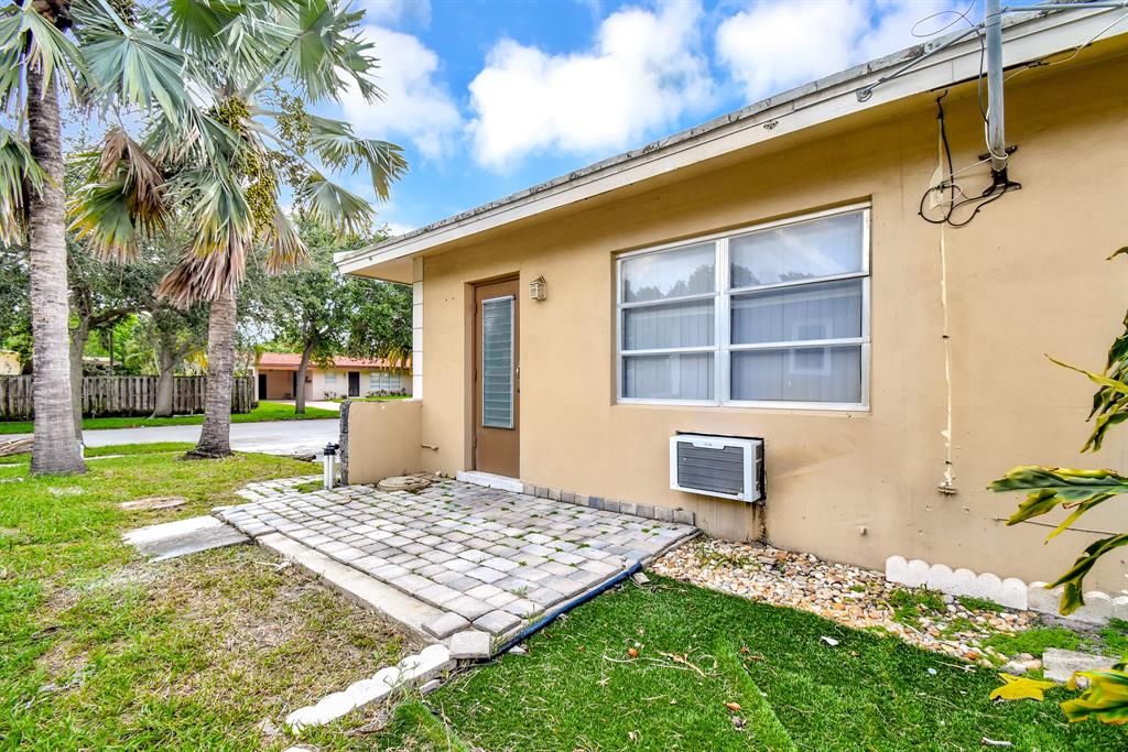4751 Northeast 21st Terrace, Unit 4 Lighthouse Point, FL 33064 - Photo 22 of 22 a front view of a house with a yard