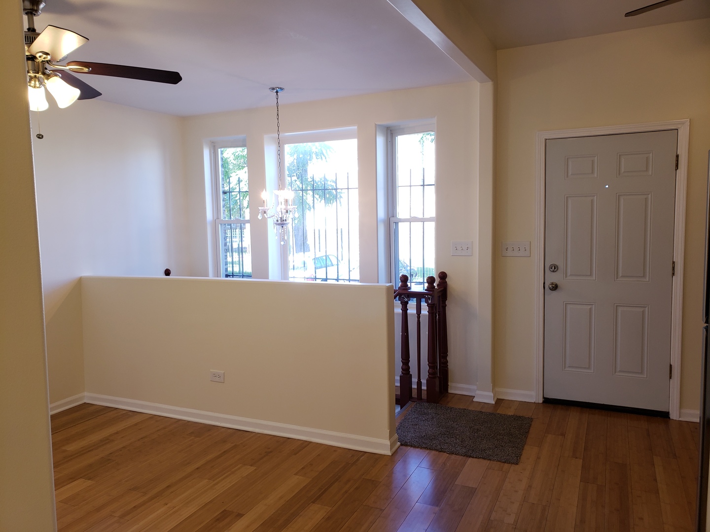 54 East 50th Street, Unit 1 Chicago, IL 60615 - Photo 11 of 27 an empty room with wooden floor and windows