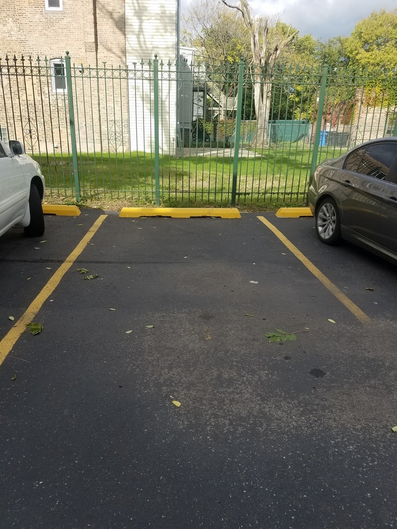 54 East 50th Street, Unit 1 Chicago, IL 60615 - Photo 27 of 27 a view of a street with a car parked in front of it