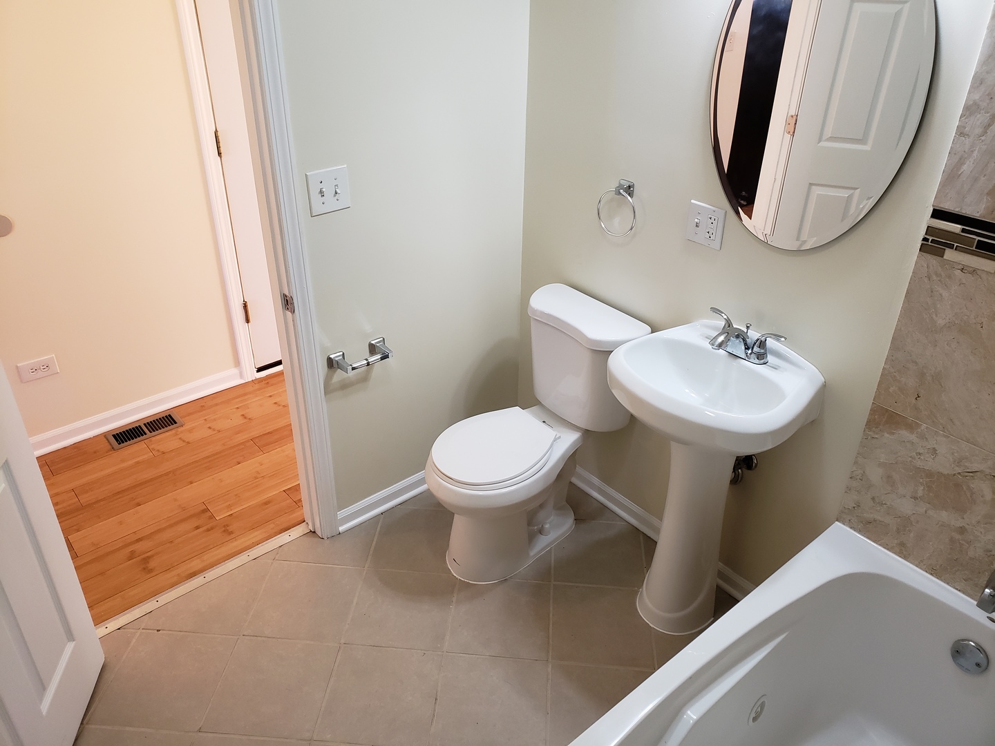 54 East 50th Street, Unit 1 Chicago, IL 60615 - Photo 10 of 27 a bathroom with a toilet sink and mirror