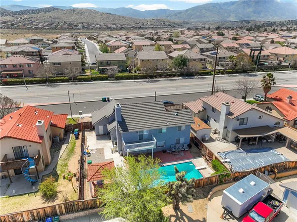 an aerial view of residential houses with outdoor space