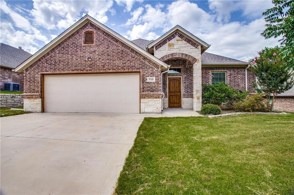 713 Westgate Drive Aledo, TX 76008 - Photo 1 of 1 a front view of a house with a yard and garage