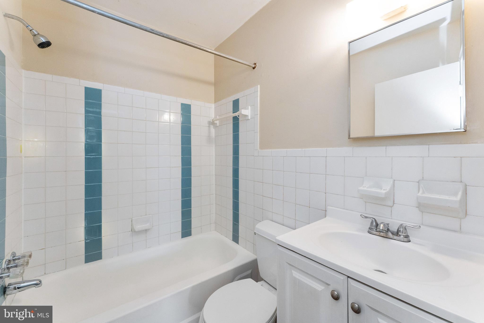 1008 Ray Road Hyattsville, MD 20783 - Photo 18 of 25 a bathroom with a sink toilet and shower