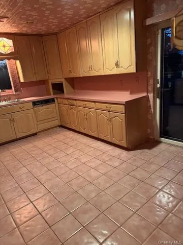 a kitchen with a cabinets and appliances