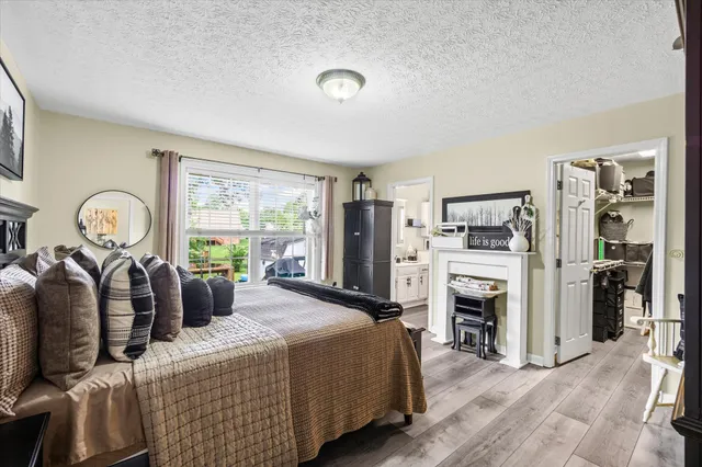 a living room with furniture a window and a flat screen tv