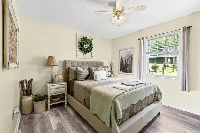 a bedroom with a bed and a window