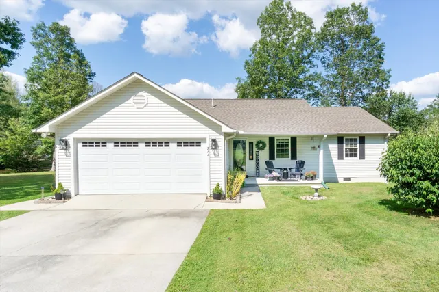 a view of house with yard