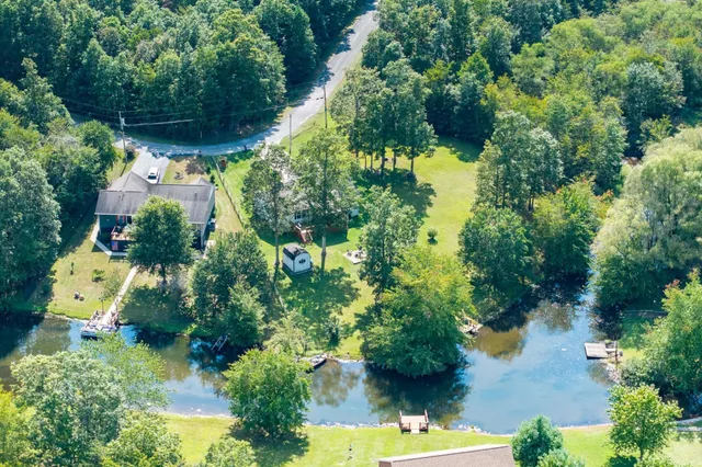 a view of a yard with swimming pool