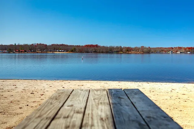 a view of a lake with a yard