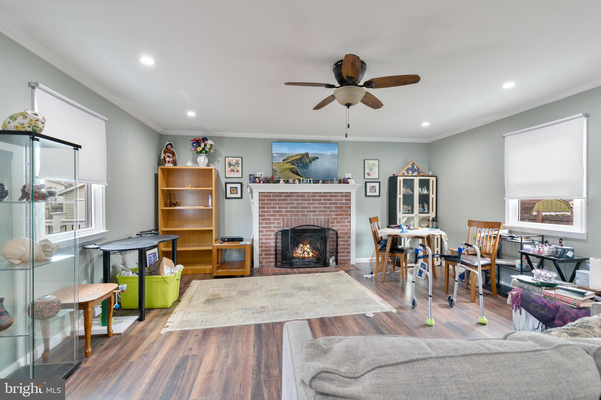 540 Eagle Place Winchester, VA 22601 - Photo 11 of 24 a living room with furniture a fireplace and a flat screen tv