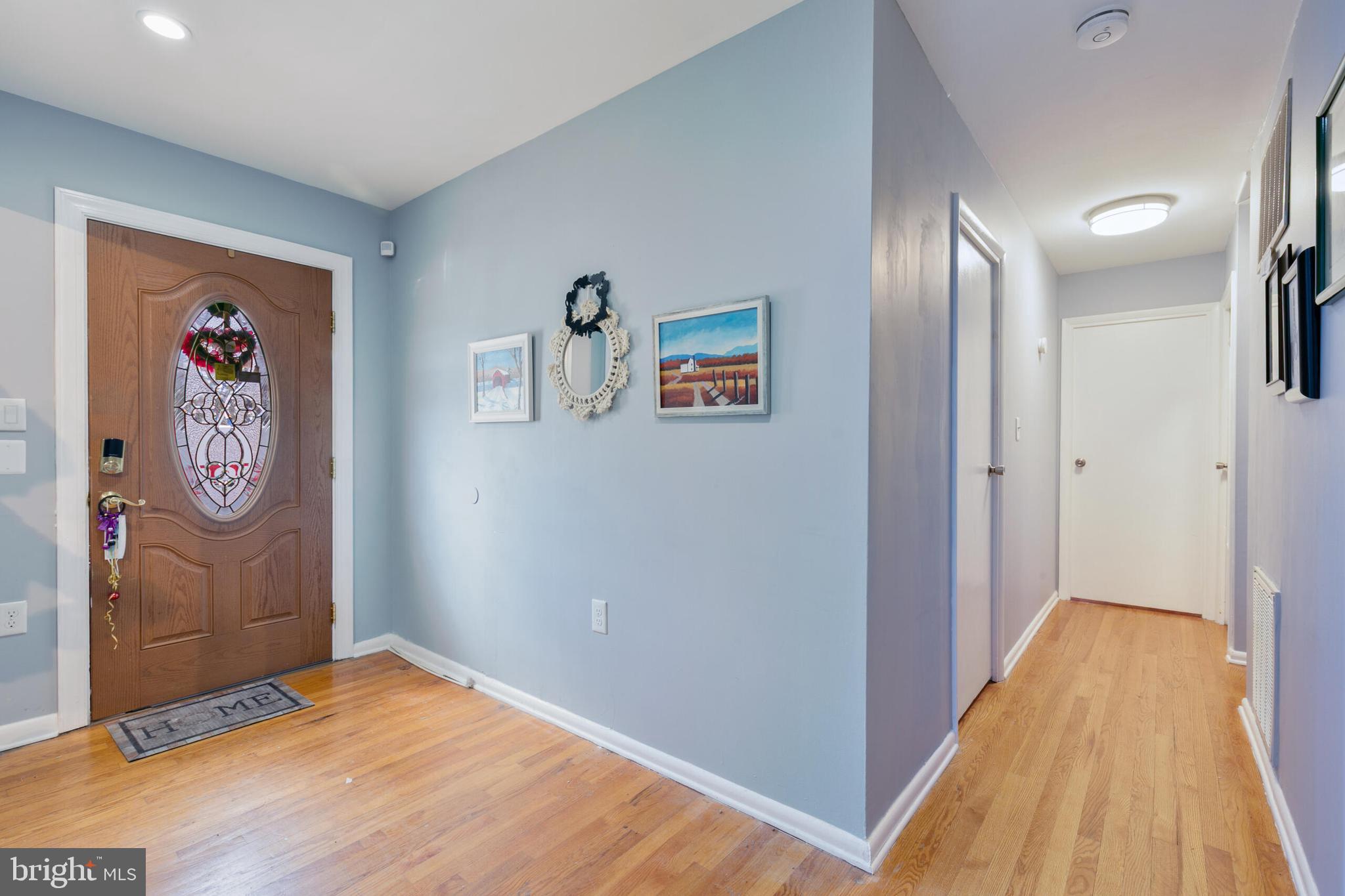 540 Eagle Place Winchester, VA 22601 - Photo 4 of 24 a view of a hallway with wooden floor