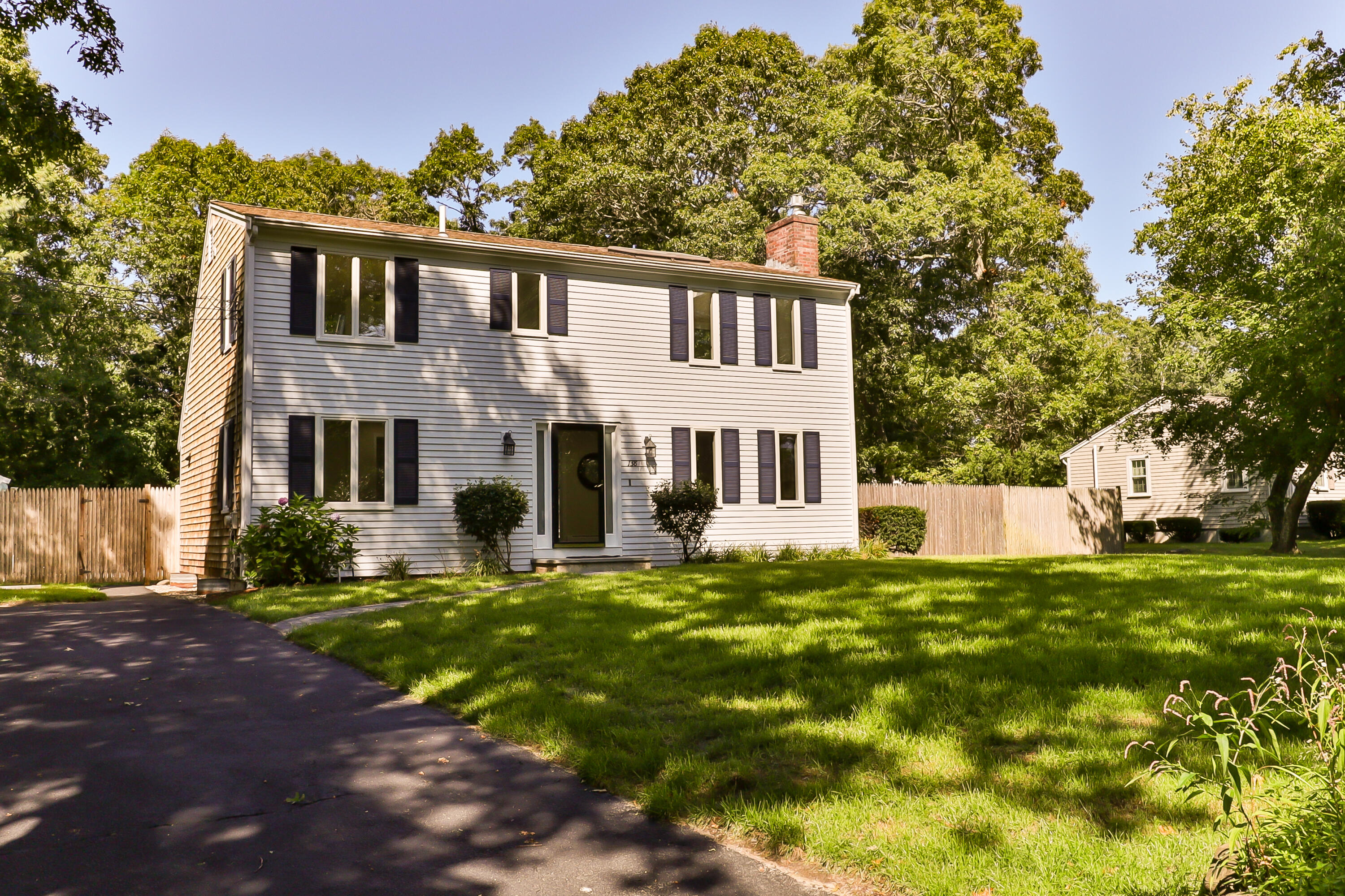 138 Lumbert Mill Road Centerville, MA 02632 - Photo 1 of 29 a view of a house with a yard