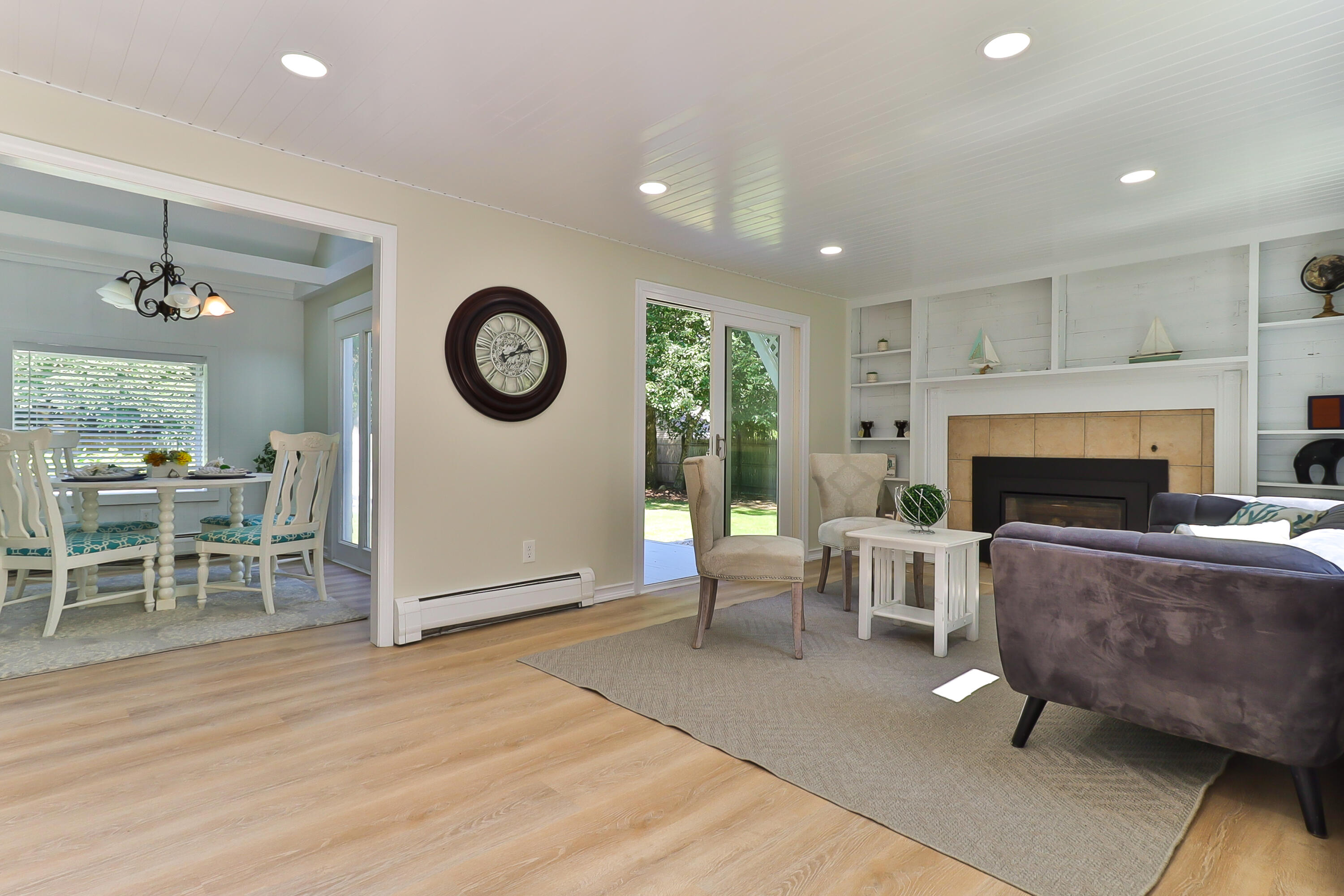 138 Lumbert Mill Road Centerville, MA 02632 - Photo 5 of 29 a living room with furniture a fireplace and a table