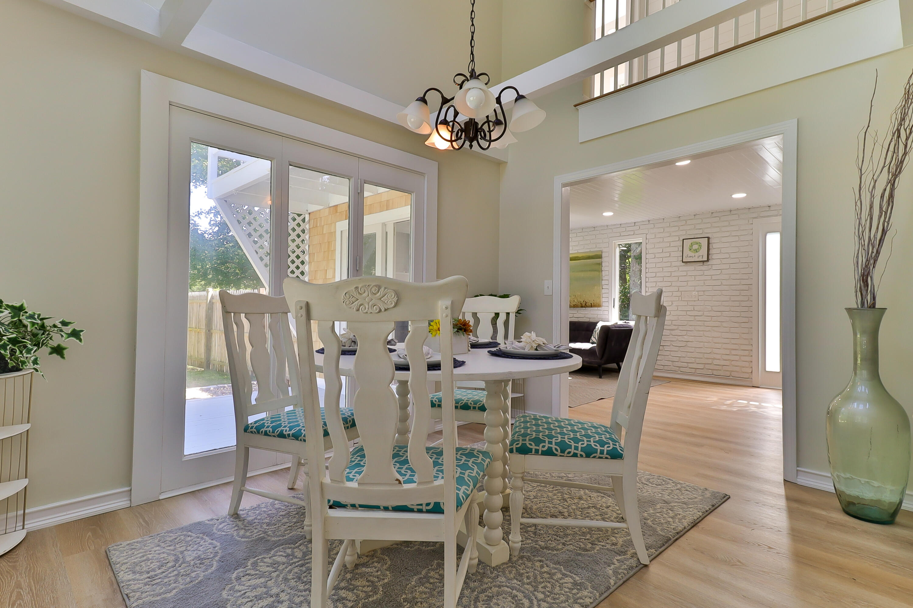 138 Lumbert Mill Road Centerville, MA 02632 - Photo 9 of 29 a view of a dining room with furniture and a chandelier