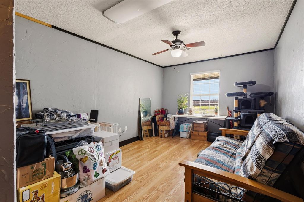 472 Milton-Minter Road Deport, TX 75435 - Photo 20 of 30 a living room with furniture and a wooden floor