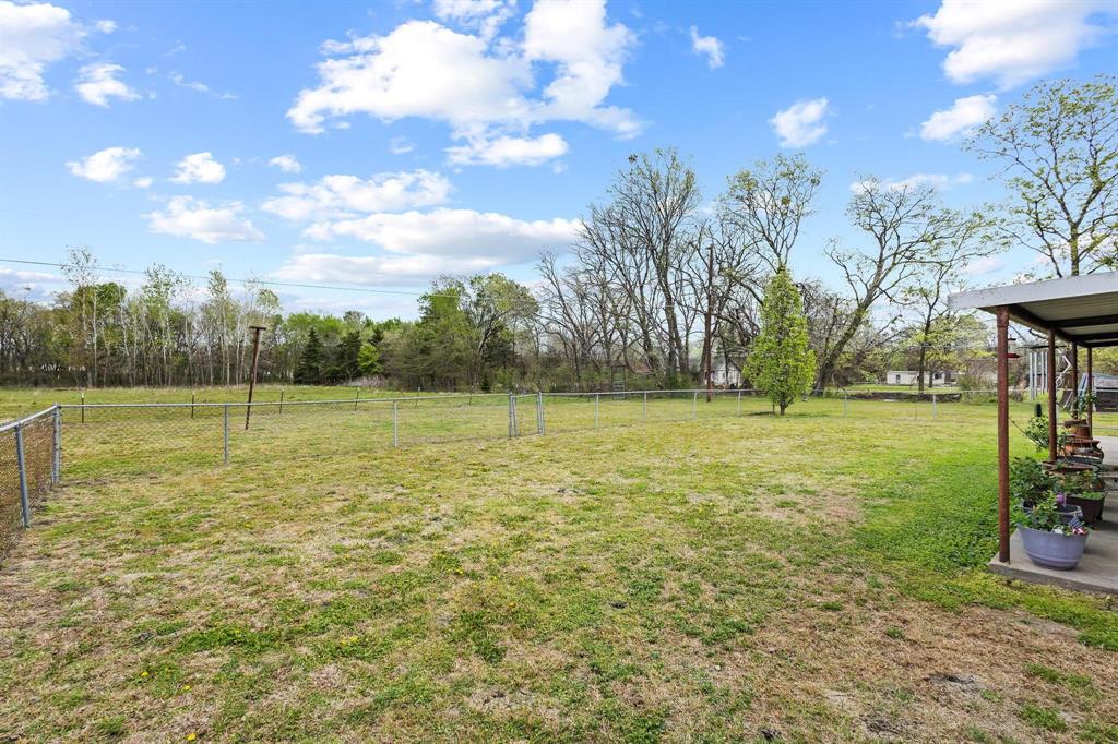 472 Milton-Minter Road Deport, TX 75435 - Photo 28 of 30 a view of a field with an trees in the background