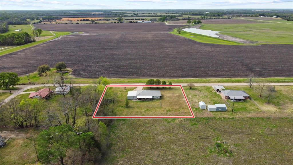 472 Milton-Minter Road Deport, TX 75435 - Photo 30 of 30 a view of a swimming pool with a yard