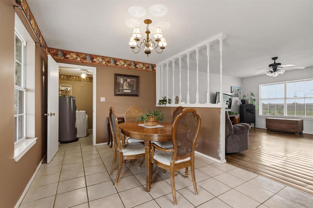 472 Milton-Minter Road Deport, TX 75435 - Photo 8 of 30 a view of a dining room with furniture and a chandelier