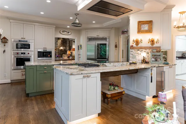 a kitchen with sink cabinets and wooden floor