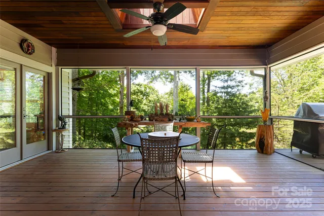 a dining room with wooden floor and outdoor seating