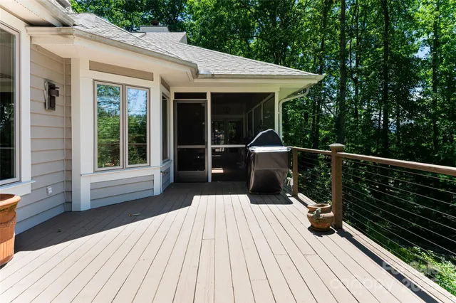 a bedroom with bed and glass windows