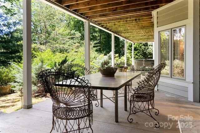 a view of an outside dining space with furniture
