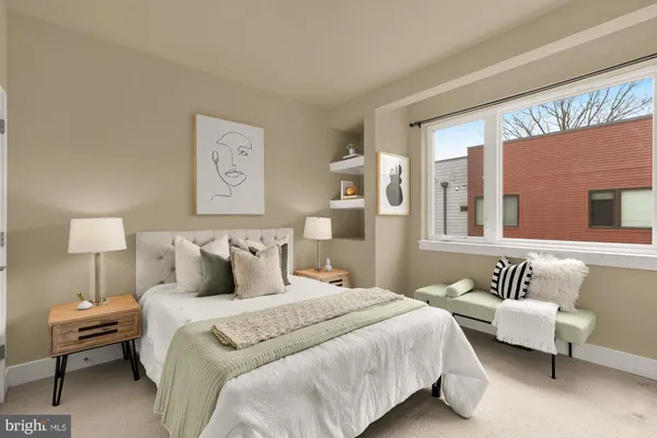 a bedroom with bed and a couch