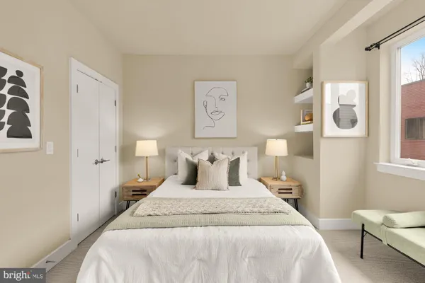 a bedroom with bed and window