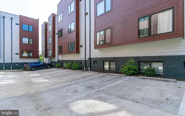 a front view of a building with a yard