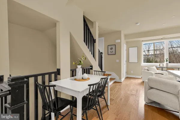 a view of a dining room with furniture and a large window